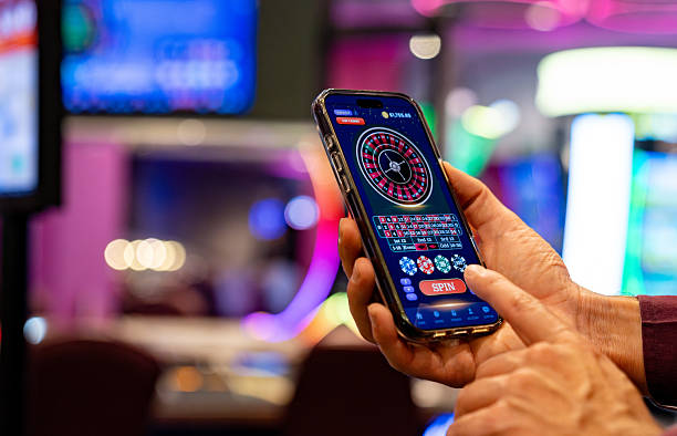 Mobile phone showing QRIS and GoPay payment icons in a digital wallet interface